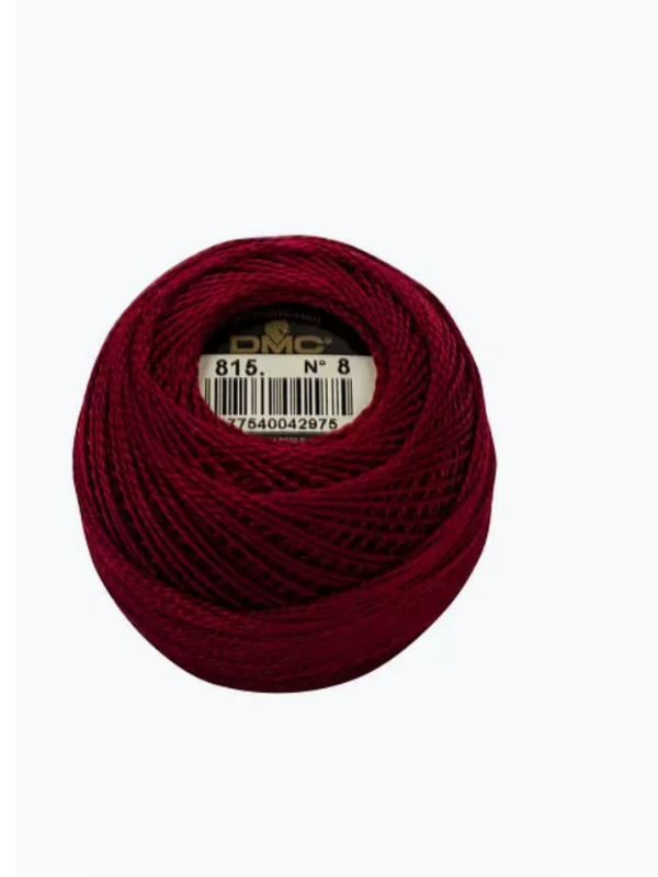 A ball of Dmc helmilanka nro 8 in deep burgundy with a subtle satin shine, neatly wound and labeled with the number 815 and No. 8 at its center.