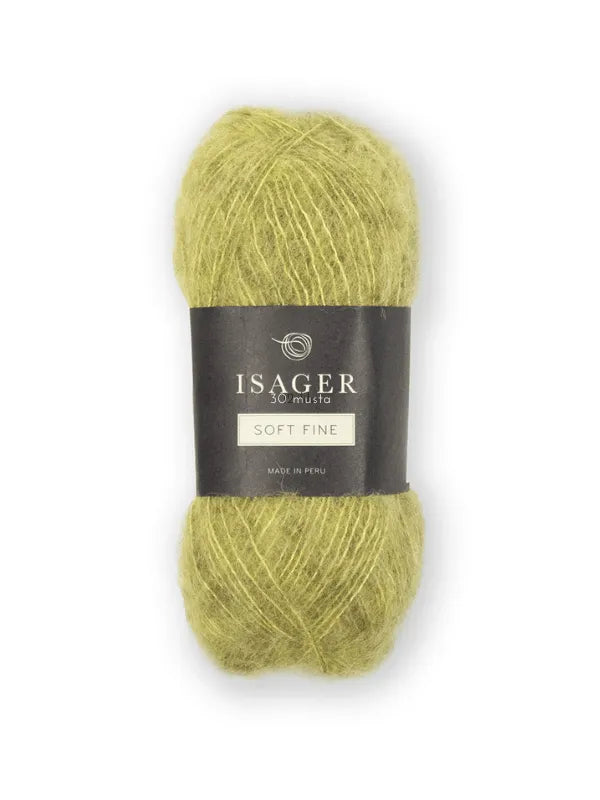 A skein of light green Isager Soft Fine yarn with a black label wrapped around the center, shown against a plain white background.
