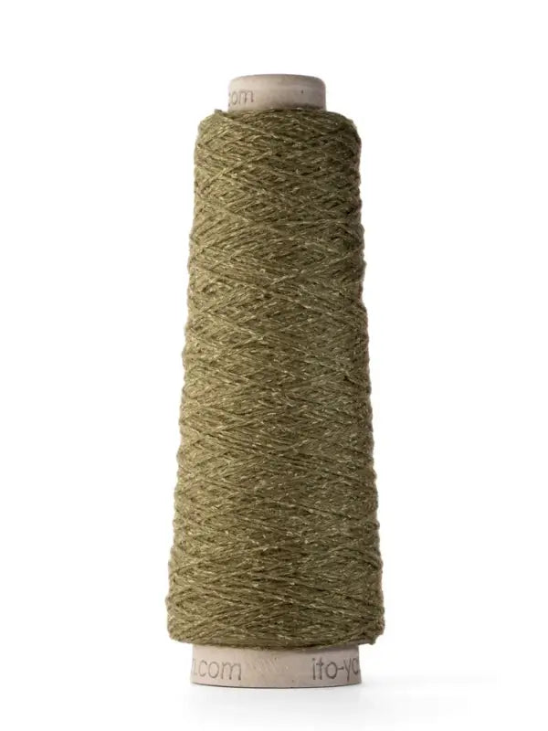 A spool of Ito Yarn Shimo in olive green, spun from merinovillalanka and kierrätetty silkki, stands upright against a white background.