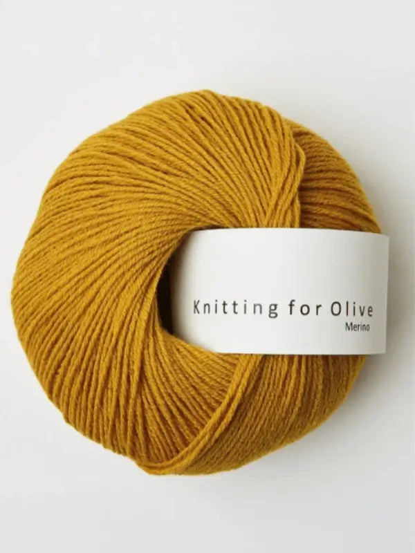 A ball of Knitting for Olive Merino in mustard yellow, Öko-Tex certified, is displayed against a white background.