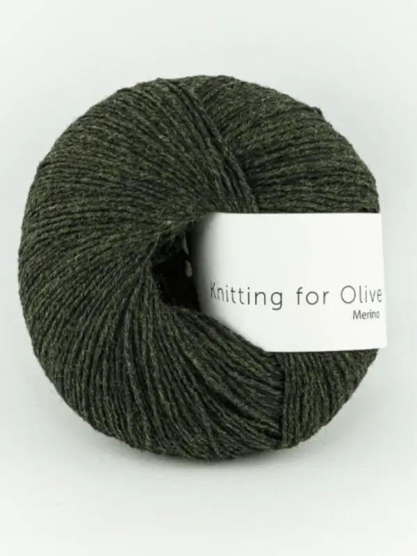 A dark green ball of Knitting for Olive Merino yarn with a white label is shown against a plain white background.