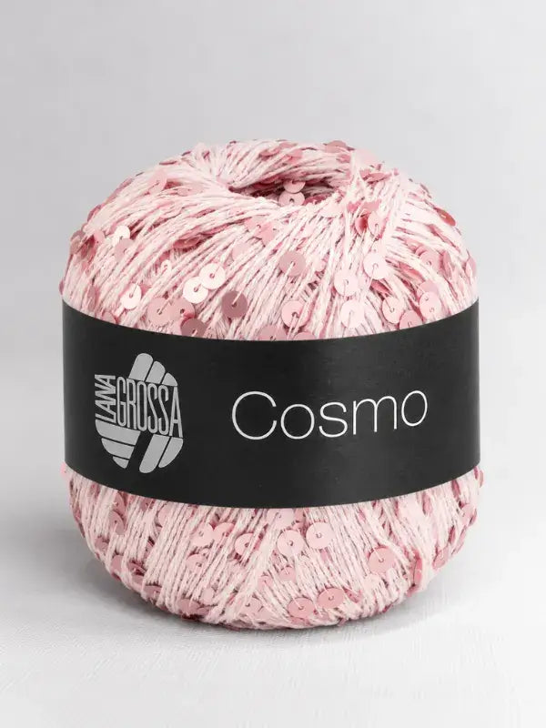 A ball of pale pink Lana Grossa Cosmo yarn adorned with small, matching sequins.