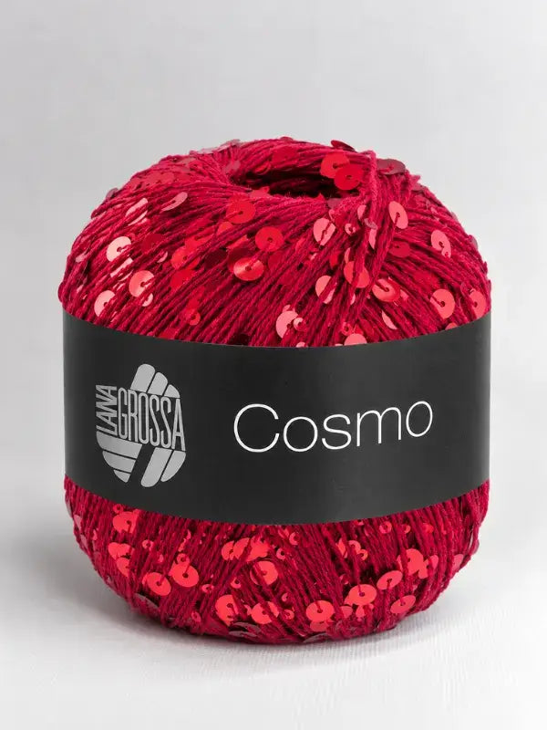 A round ball of deep red Lana Grossa Cosmo yarn embellished with matching red sequins.