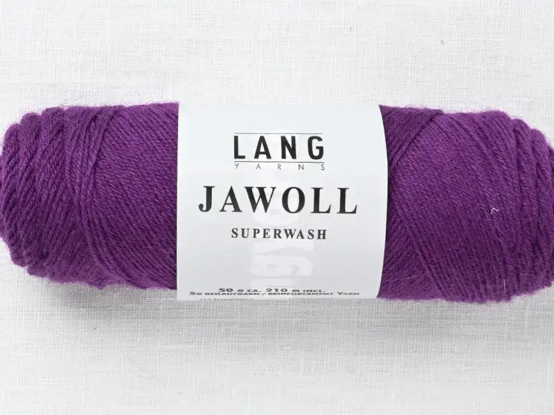 A skein of deep purple Lang Yarns Jawoll yarn wrapped in a white label.