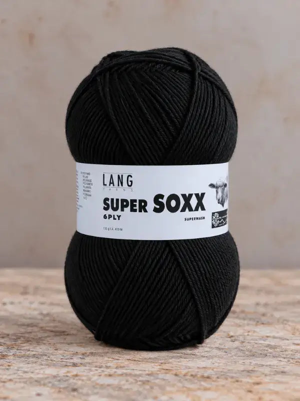A ball of solid black Lang Yarns Super Soxx 6 ply – kestävä sukkalanka villasta yarn with a paper label.