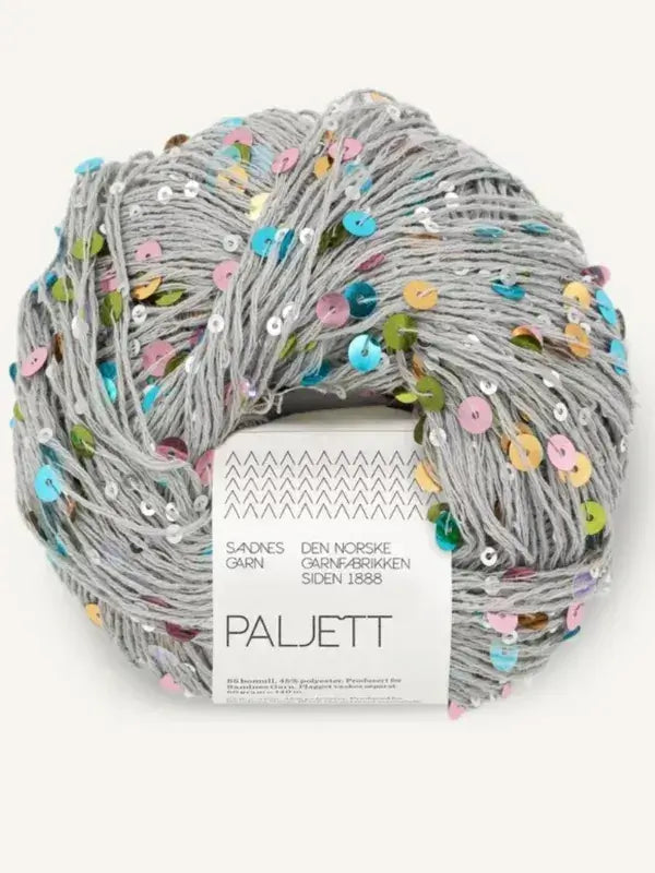 A skein of grey Sandnes Garn Paljett yarn embellished with multicolored sequins, wrapped in a paper label with product details.