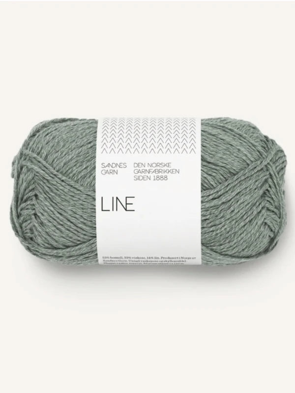 A skein of Sandnes Garn Line from the PetiteKnit Anker's Summer Shirt kit, shown in greenish-grey with a white Norwegian label, ideal for sweaters like Anker's Summer Shirt. The soft yarn sits on a plain light background.