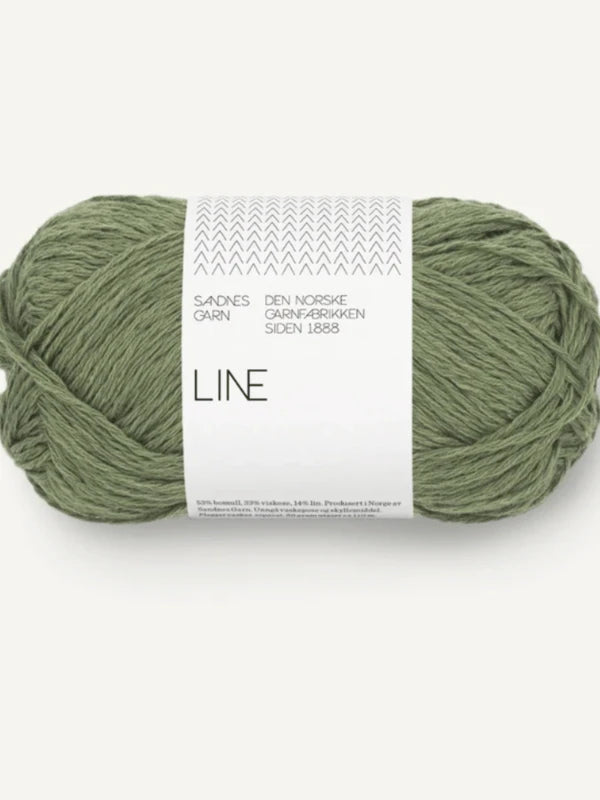 A skein of green Sandnes Garn Line from the PetiteKnit Anker's Summer Shirt + Sandnes Garn Line set, with white Norwegian-labeled packaging—ideal for your neulesetti or Anker's Summer Shirt projects.