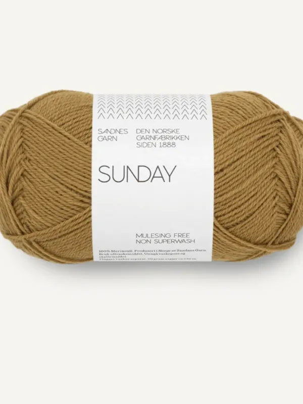 A skein of Sandnes Garn Sunday, a brown fingering-weight yarn made from mulesing-free merino wool (non-superwash), is neatly wound with a white label against a plain background.