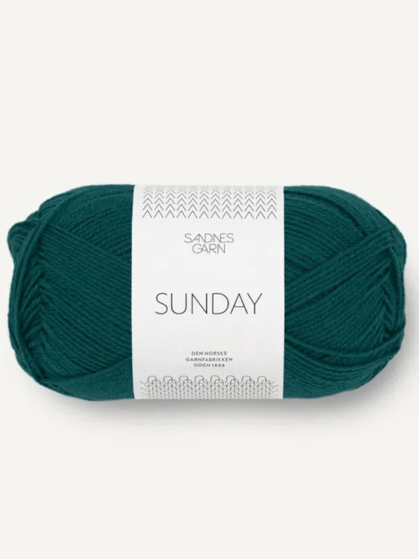 A skein of teal Sandnes Garn Sunday, a fingering-weight mulesing-free merino yarn, with a white minimalist label and small line drawing.