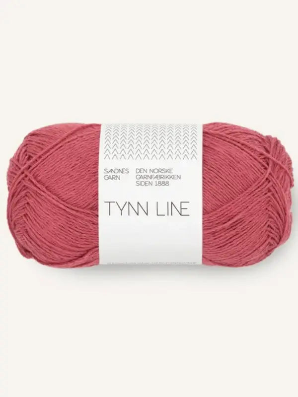 A skein of Sandnes Garn Tynn Line pink yarn with a white Norwegian-labeled band. The fingering-weight yarn is neatly wound into an oval shape.