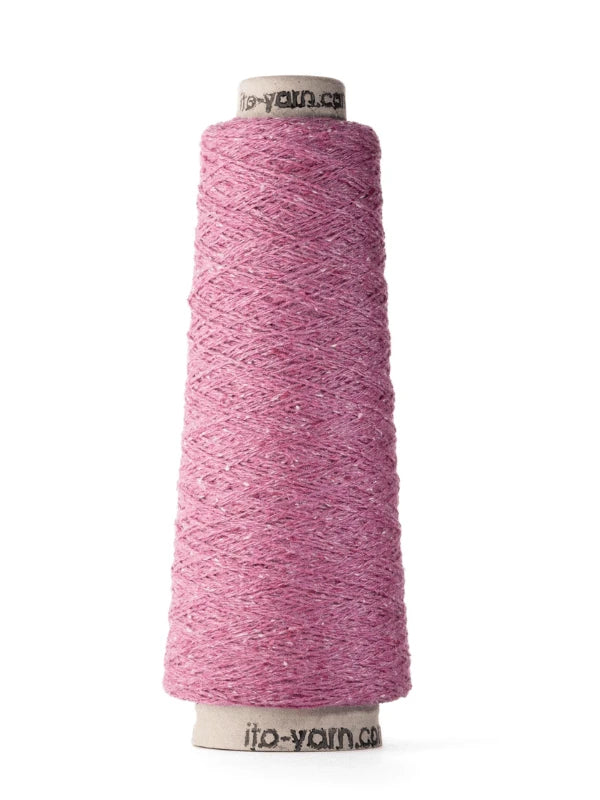 A cone of Ito Kinu pink textured japanilainen silkkilanka with subtle color variations, wound on a cylindrical spool labeled ito-yarn.com—the perfect 100% silkki touch for kesäneuleisiin, shown upright on a white background.