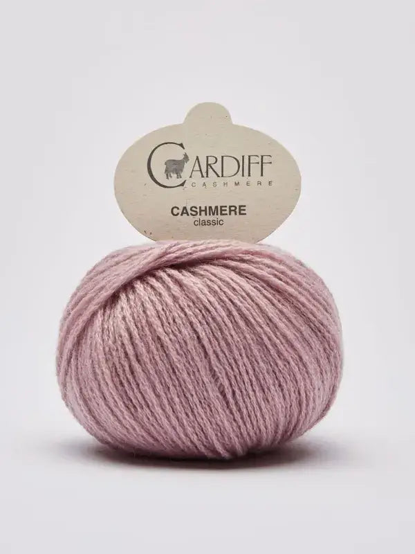 A ball of light pink Cardiff Cashmere Classic – 100 % kashmirlanka yarn on a white background.