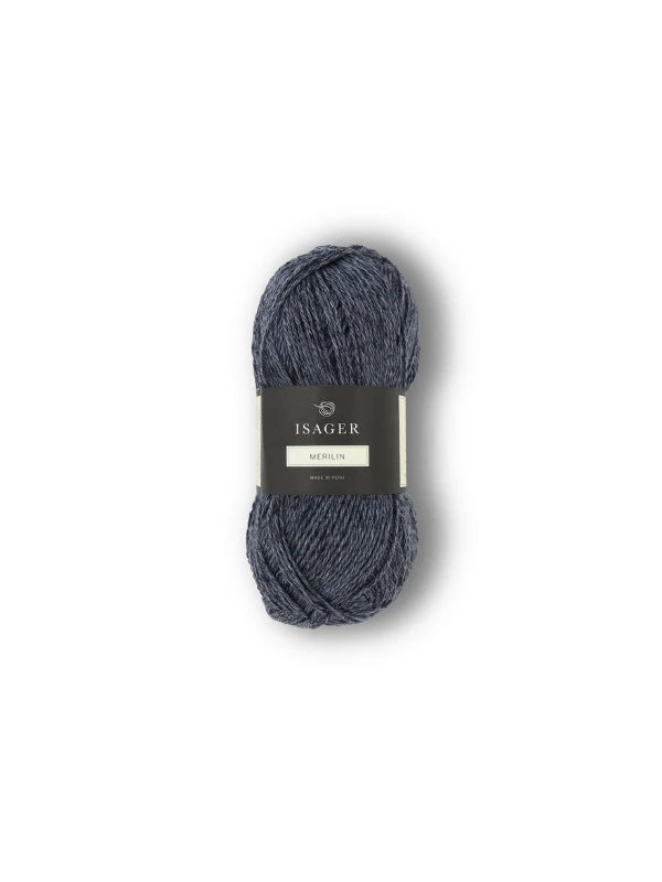 A skein of dark gray-blue Isager Merlin yarn with a black and white paper band, shown isolated on a plain white background.