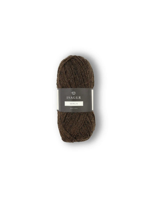 An upright skein of dark brown merinovillalanka yarn with a gray Isager Merlin label sits against a plain white background.