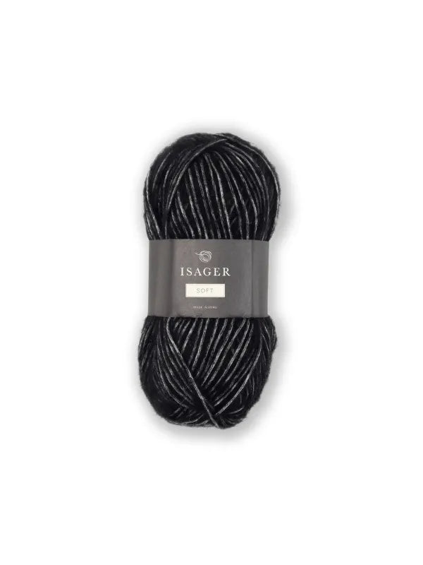 A skein of Isager Soft alpakka yarn in black and gray variegated shades, wrapped with a gray paper band, displayed on a plain white background.