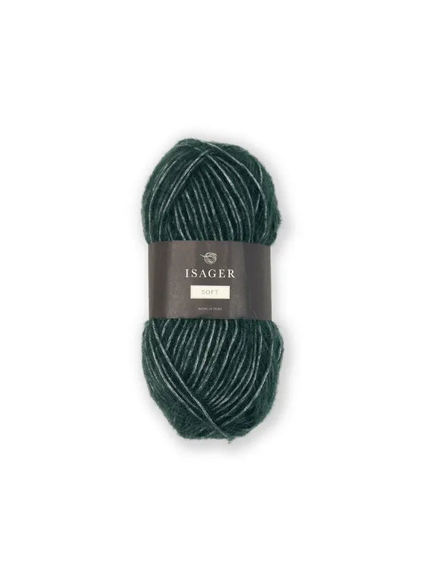 A skein of dark green Isager Soft, labeled with a gray band and shown on a white background, ideal for pehmeä neulelanka projects.