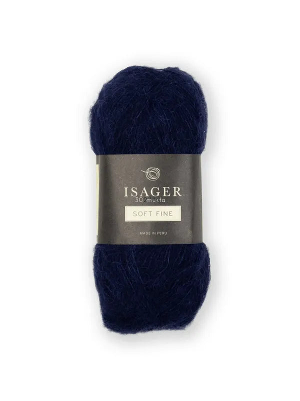 A skein of dark navy blue Isager Soft Fine yarn, wrapped in a black label with the brand and product name plus "Made in Peru," is shown on a plain white background.