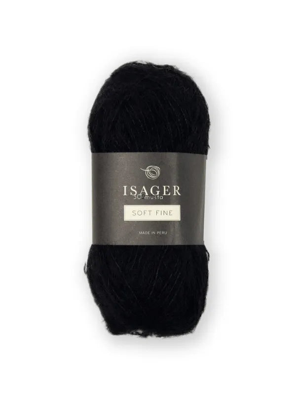 A skein of black Isager Soft Fine yarn—an alpaca silk blend and lace-weight yarn—with a gray wrapper, photographed on a white background.