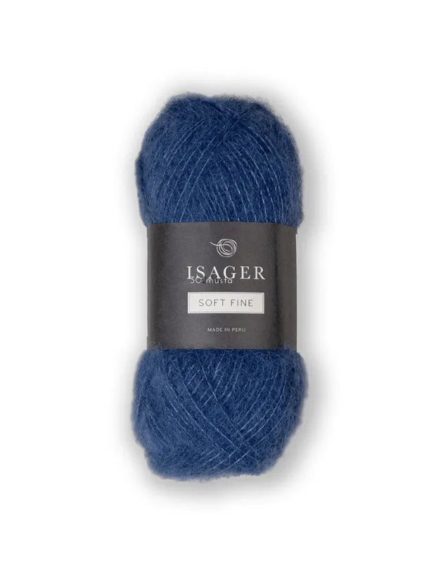 A skein of blue Isager Soft Fine yarn with a black label showing the brand name and product details against a white background. This lace-weight alpaca silk yarn is ideal for delicate, lightweight projects.