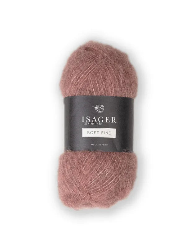 A skein of Isager Soft Fine in dusty rose, with a black and white label showing the brand name and details. This lace-weight alpaca silk yarn is ideal for delicate projects.