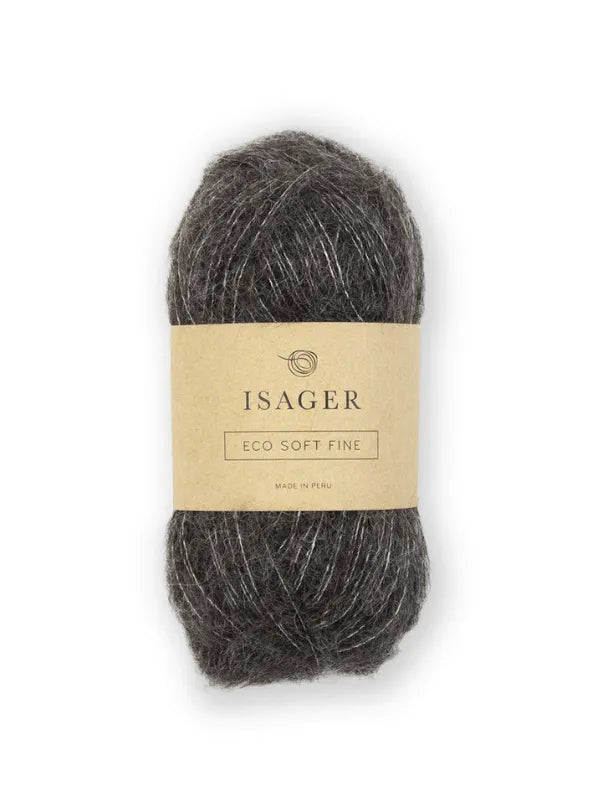 A skein of dark gray Isager Soft Fine yarn featuring a beige label that reads "ISAGER ECO SOFT FINE Made in Peru" is displayed against a white background.