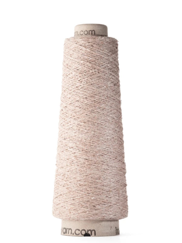 A cone of light beige Ito Kinu japanilainen silkkilanka stands upright against a white background. The 100% silkki yarn is tightly wound around a cardboard core—perfect for kesäneuleisiin.