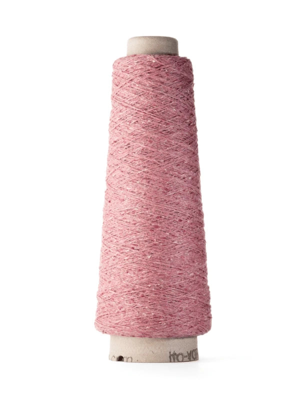 A cone of pink Ito Kinu japanilainen silkkilanka yarn wound around a cardboard spool stands upright against a white background—perfect for kesäneuleisiin.