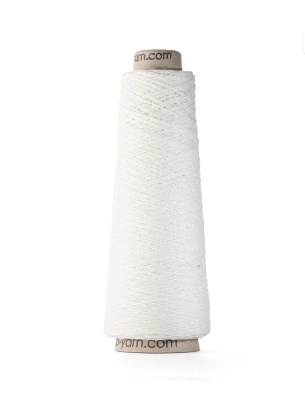 A cone of Ito Kinu white japanilainen silkkilanka stands upright against a plain background, tightly wound with a visible cardboard core—ideal for kesäneuleisiin.