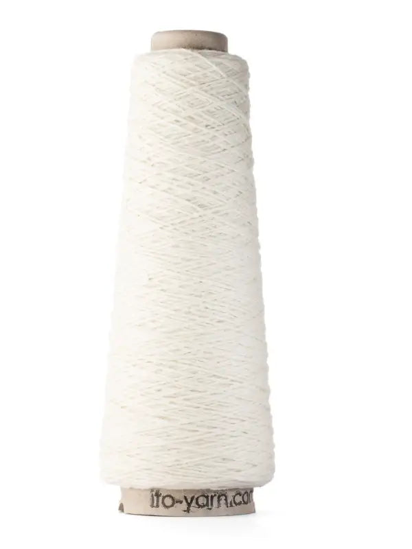 A tall cone of Ito Yarn Shimo stands upright on a plain background. The cone’s base has ifo-yarn.com printed on it. The white yarn, tightly wound in even layers around the cardboard core, is a blend of merinovillalanka and kierrätetty silkki.