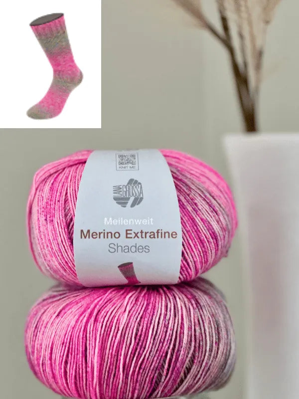 A close-up shows two skeins of pink and gray Lana Grossa Meilenweit 100 Merino extrafine Shades yarn. Above, a small inset features a sock knitted from matching merinosukkalanka in similar tones.