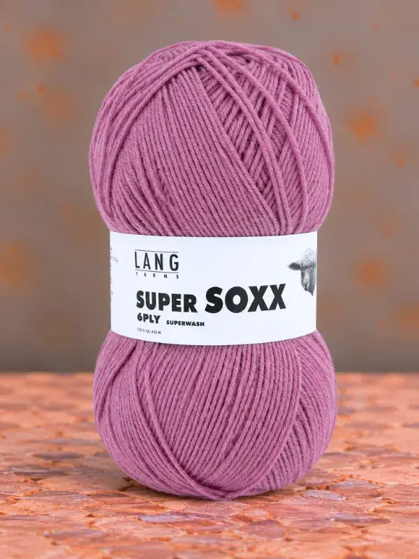 A ball of Lang Yarns Super Soxx 6 ply mauve wool yarn wrapped in a label.