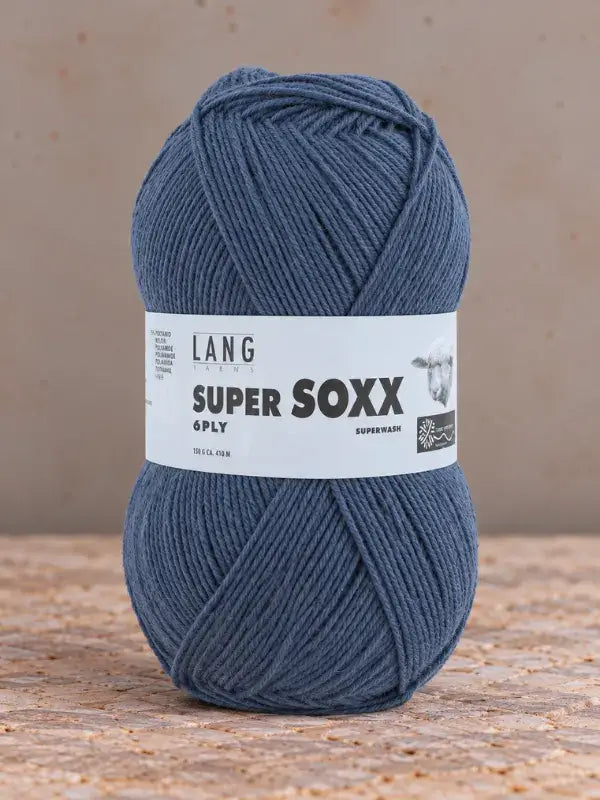 A ball of blue Lang Yarns Super Soxx 6 ply – kestävä sukkalanka villasta wrapped in a label.