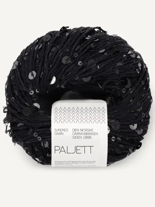 A skein of black Sandnes Garn Paljett yarn embellished with small, round black sequins and a white product label.
