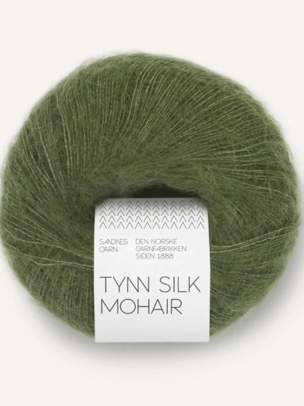 A ball of olive green Sandnes Garn Tynn Silk Mohair yarn with a white label.