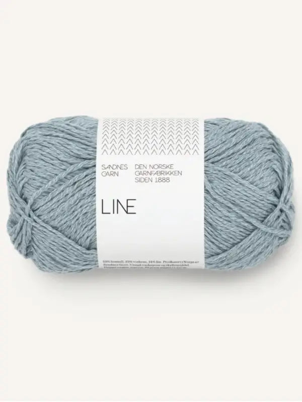 A skein of light blue Sandnes Garn Line, labeled “LINE” in white packaging with Norwegian text, is soft and oval-shaped—perfect for making the PetiteKnit Anker's Summer Shirt.